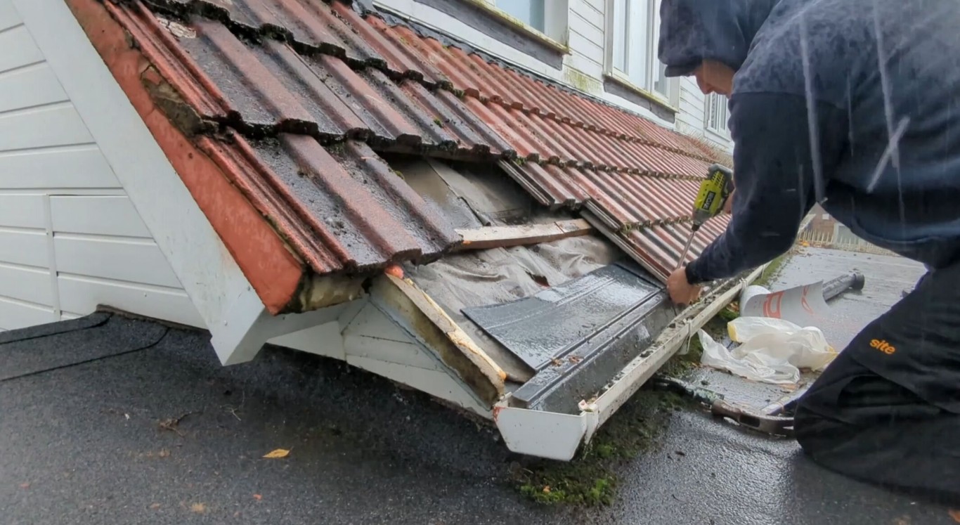 Professional roof repair service fixing damaged tiles in Cicero, IL